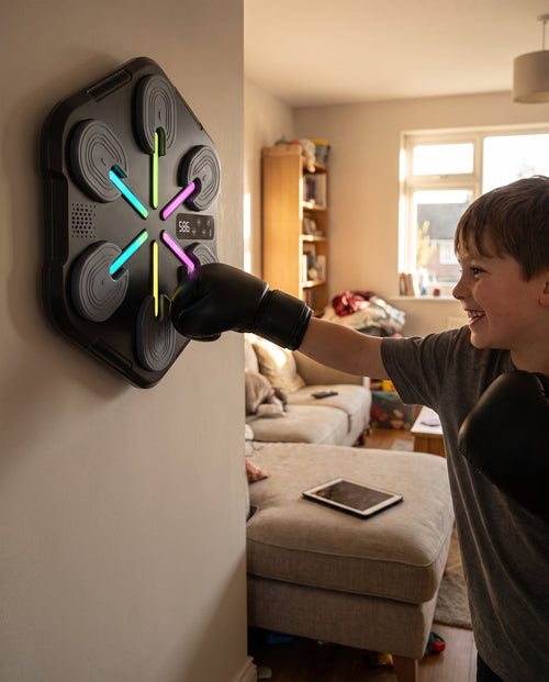 Child punching the wall-mounted BOX-COMBO in a living room